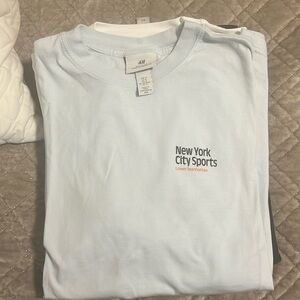 All of the shirts are large except the New York one which is medium